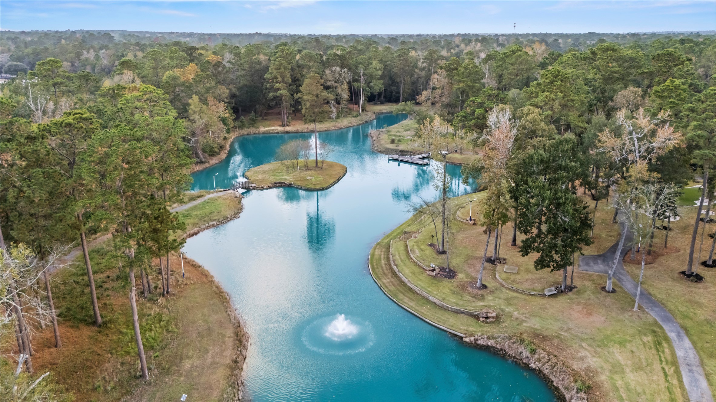 38262 Windy Ridge Trail Magnolia, TX 77355 - Photo 5 of 50 a view of a swimming pool with a yard
