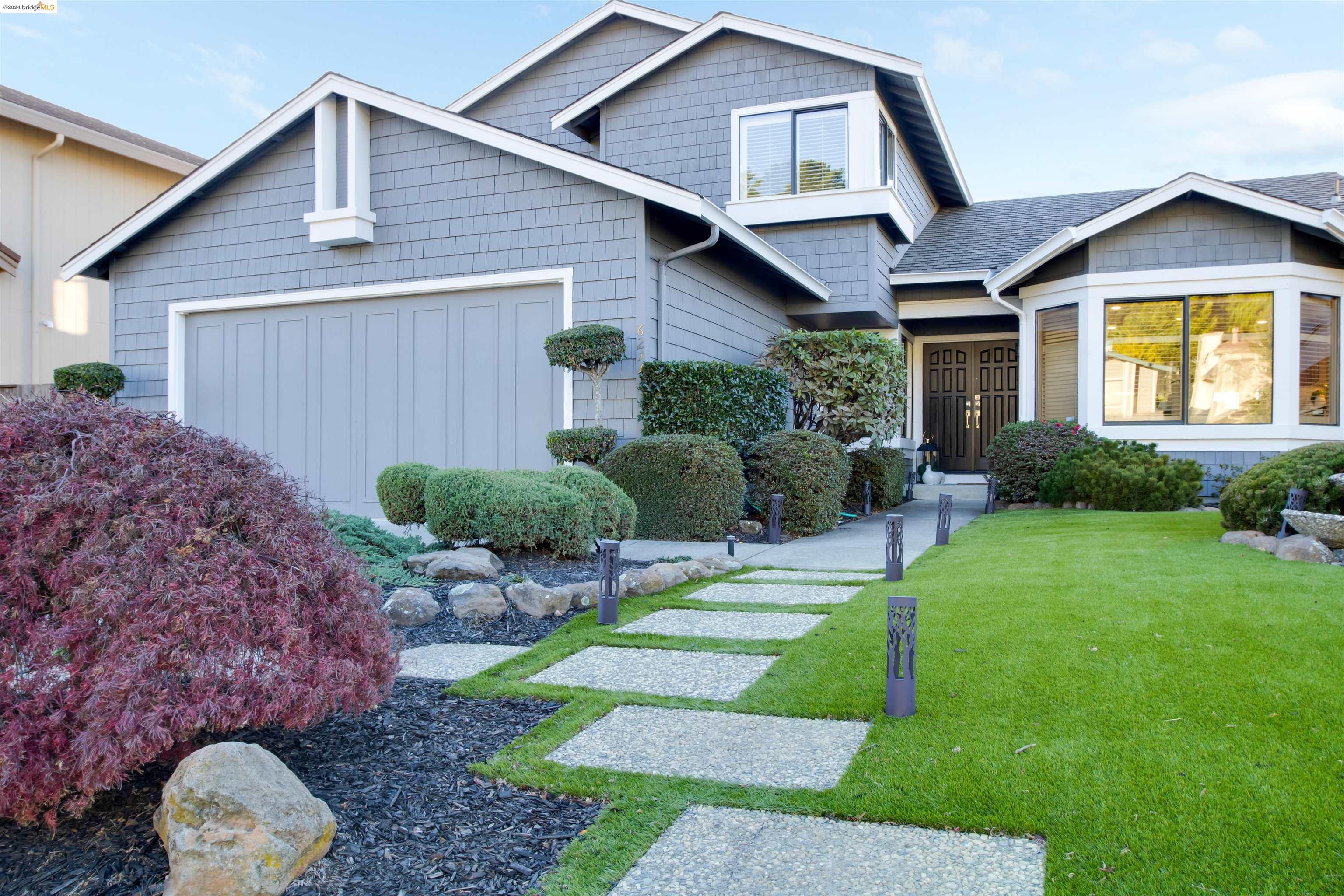 6211 Viewcrest Drive Oakland, CA 94619 - Photo 1 of 1 a front view of a house with a yard