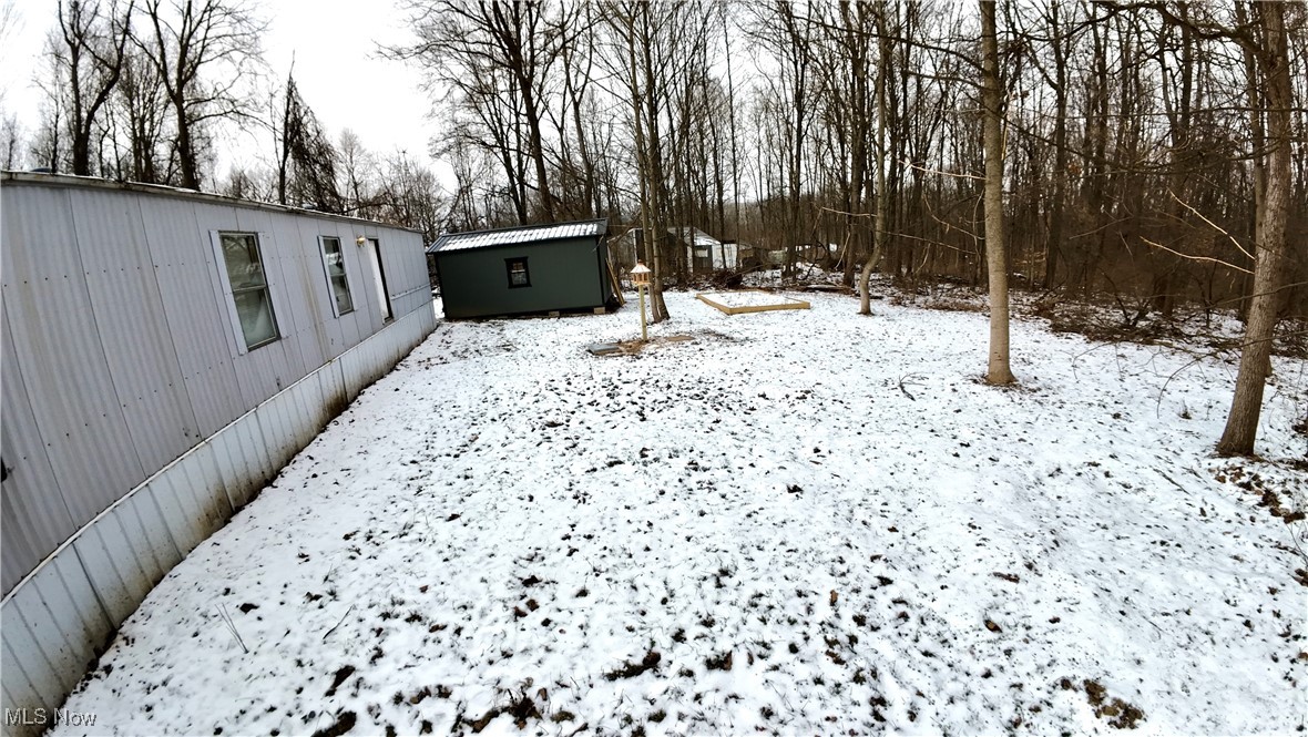 29311 Rabbit Ridge Road Howard, OH 43028 - Photo 38 of 39 Yard layered in snow featuring an outbuilding
