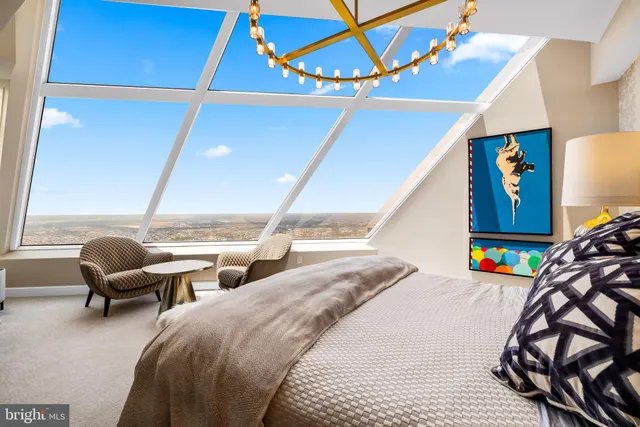 a bedroom with two beds and a window