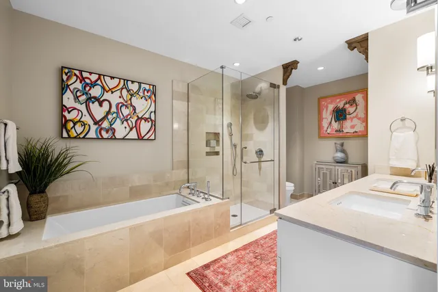 a bath room with a bath tub and a shower