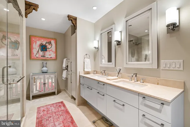 a bathroom with a sink a vanity and a mirror