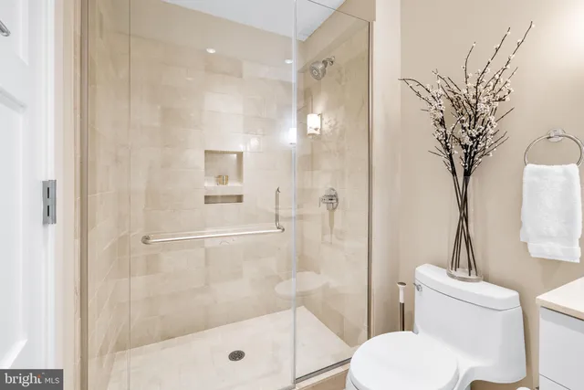 a bathroom with a shower toilet and a sink