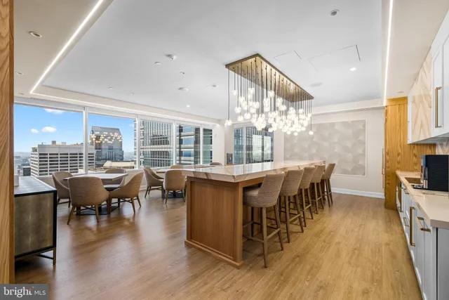 a dining hall with furniture window and wooden floor