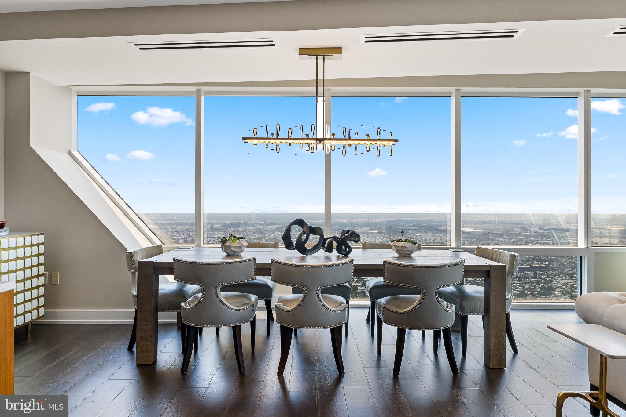 50 South 16th Street, Unit 5501 Philadelphia, PA 19103 - Photo 7 of 34 a view of a dining room with furniture window and wooden floor