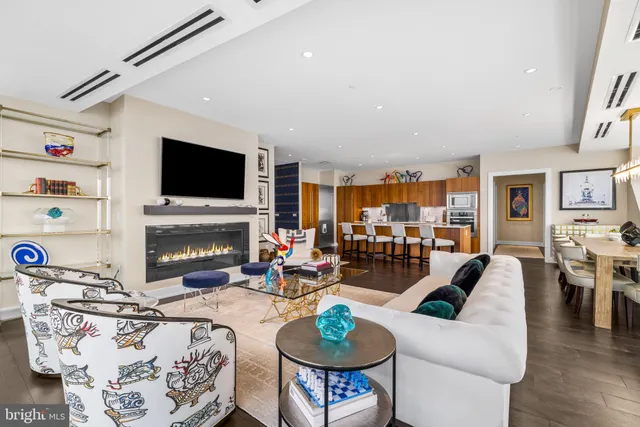 a living room with fireplace furniture and a flat screen tv