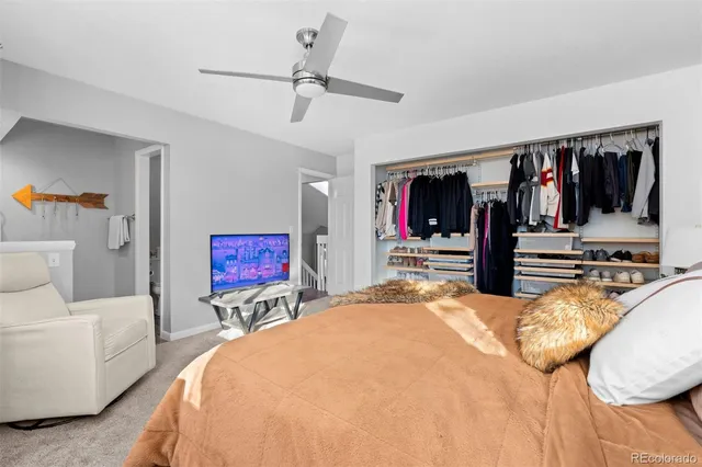 a bed room with a bed and a view of bedroom