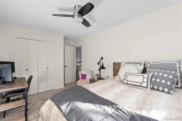 a bedroom with a bed and a chair