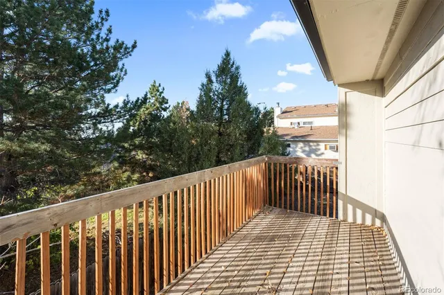 a view of balcony with wooden floor
