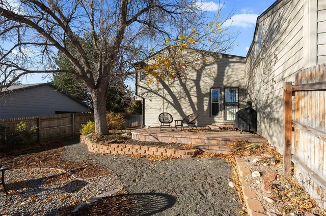 a view of a house with a yard covered in snow