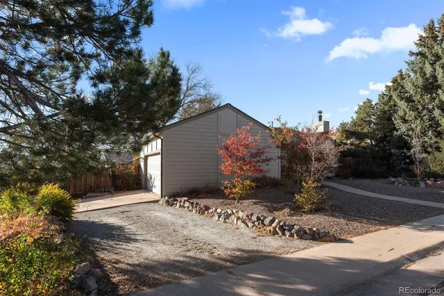 a view of a house with a yard covered in snow