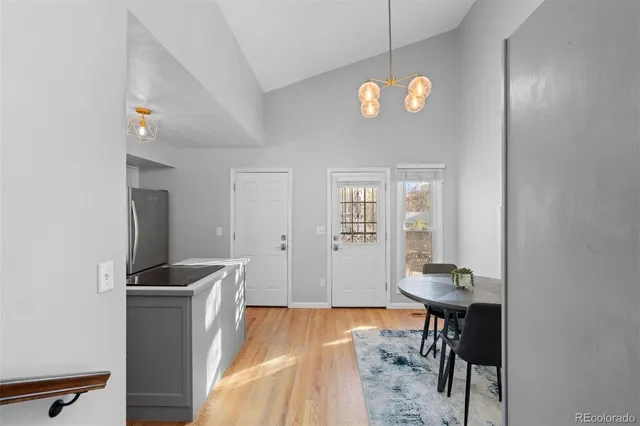 a view of a room with workspace and dining room