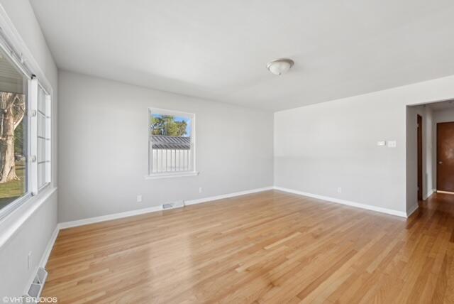4865 Connecticut Street Gary, IN 46409 - Photo 5 of 9 a view of empty room with wooden floor and fan