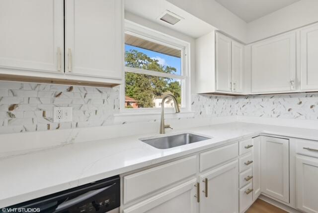 4865 Connecticut Street Gary, IN 46409 - Photo 6 of 9 a sink with white cabinets and a window