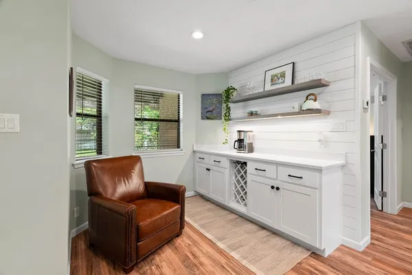 a view of kitchen with furniture and windows