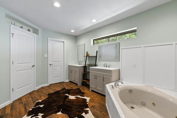 a bathroom with a bathtub sink and toilet