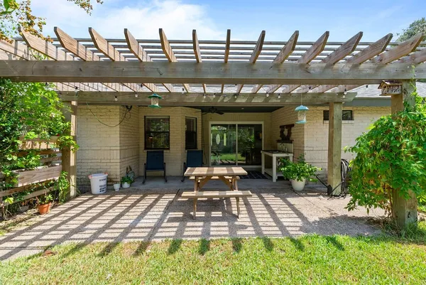 a front view of a house with a yard outdoor seating and garage