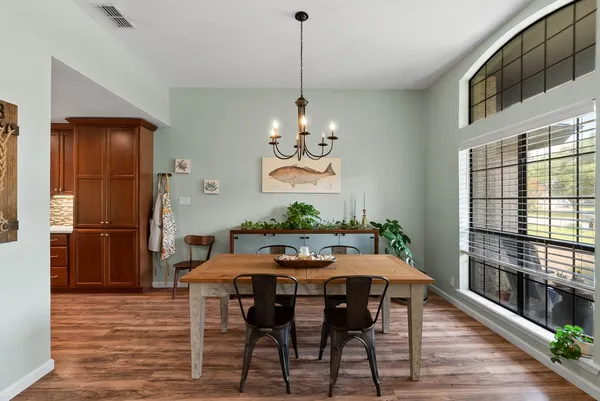 a view of a dining room with furniture window and wooden floor