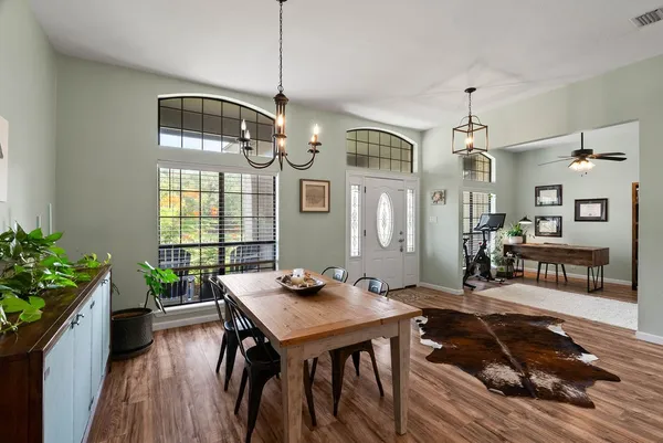 a view of a dining room with furniture window and wooden floor