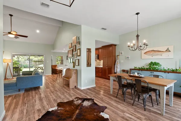 a view of a dining room with furniture window and wooden floor