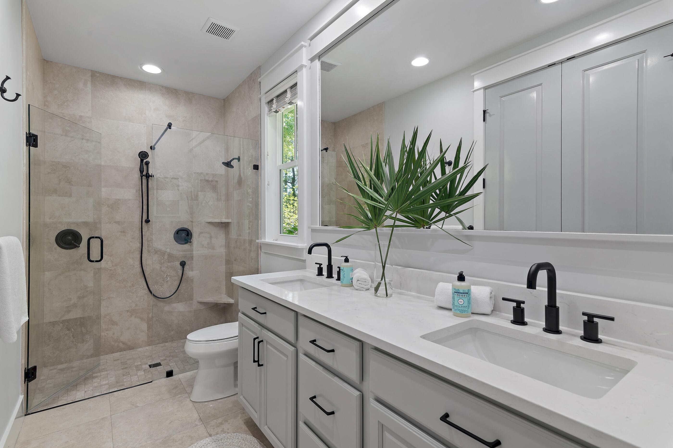 199 Anchor Rode Circle Santa Rosa Beach, FL 32459 - Photo 15 of 43 a bathroom with a double vanity sink toilet and shower