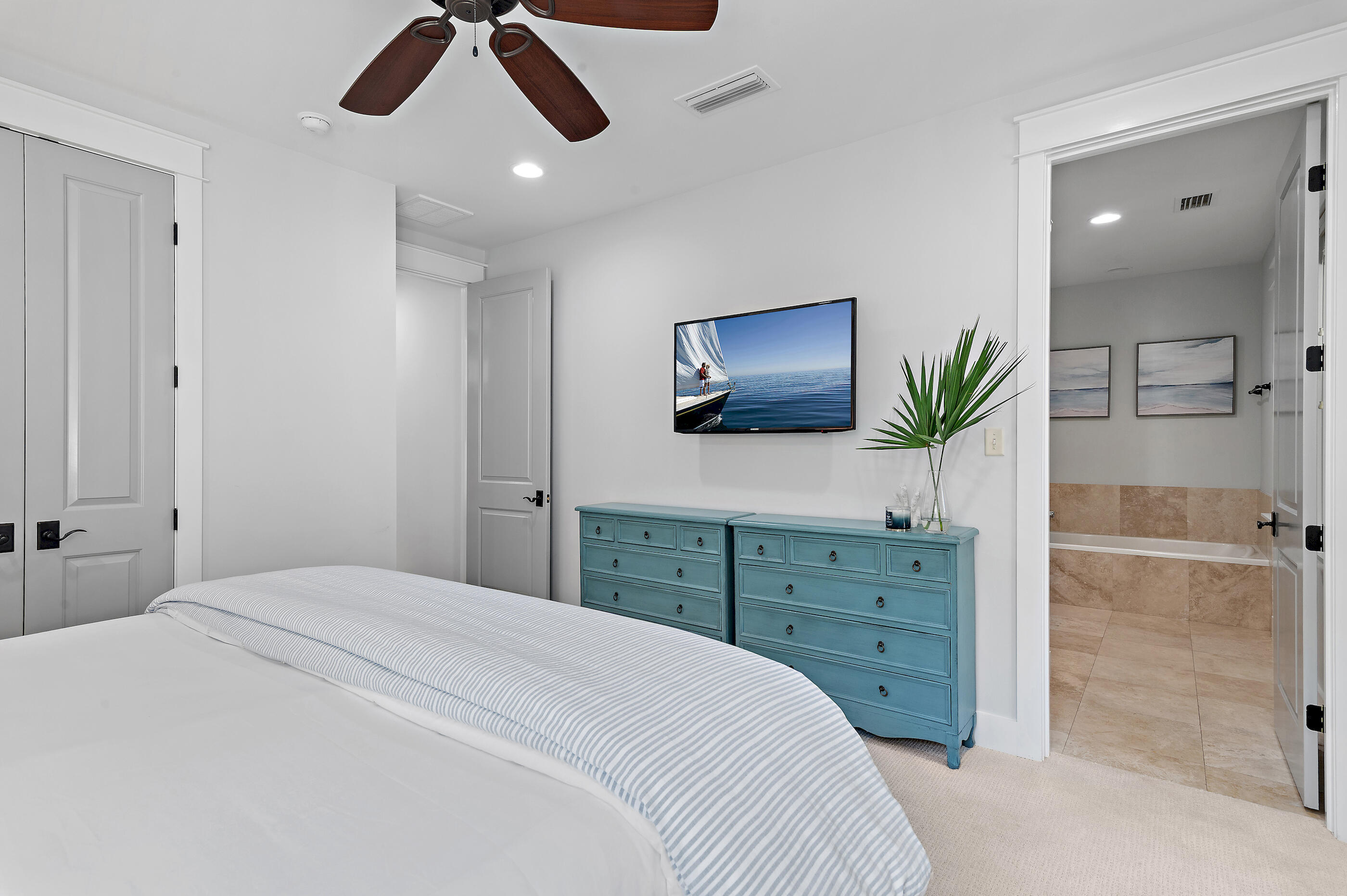 199 Anchor Rode Circle Santa Rosa Beach, FL 32459 - Photo 18 of 43 a bedroom with a large bed and a flat tv screen on dresser