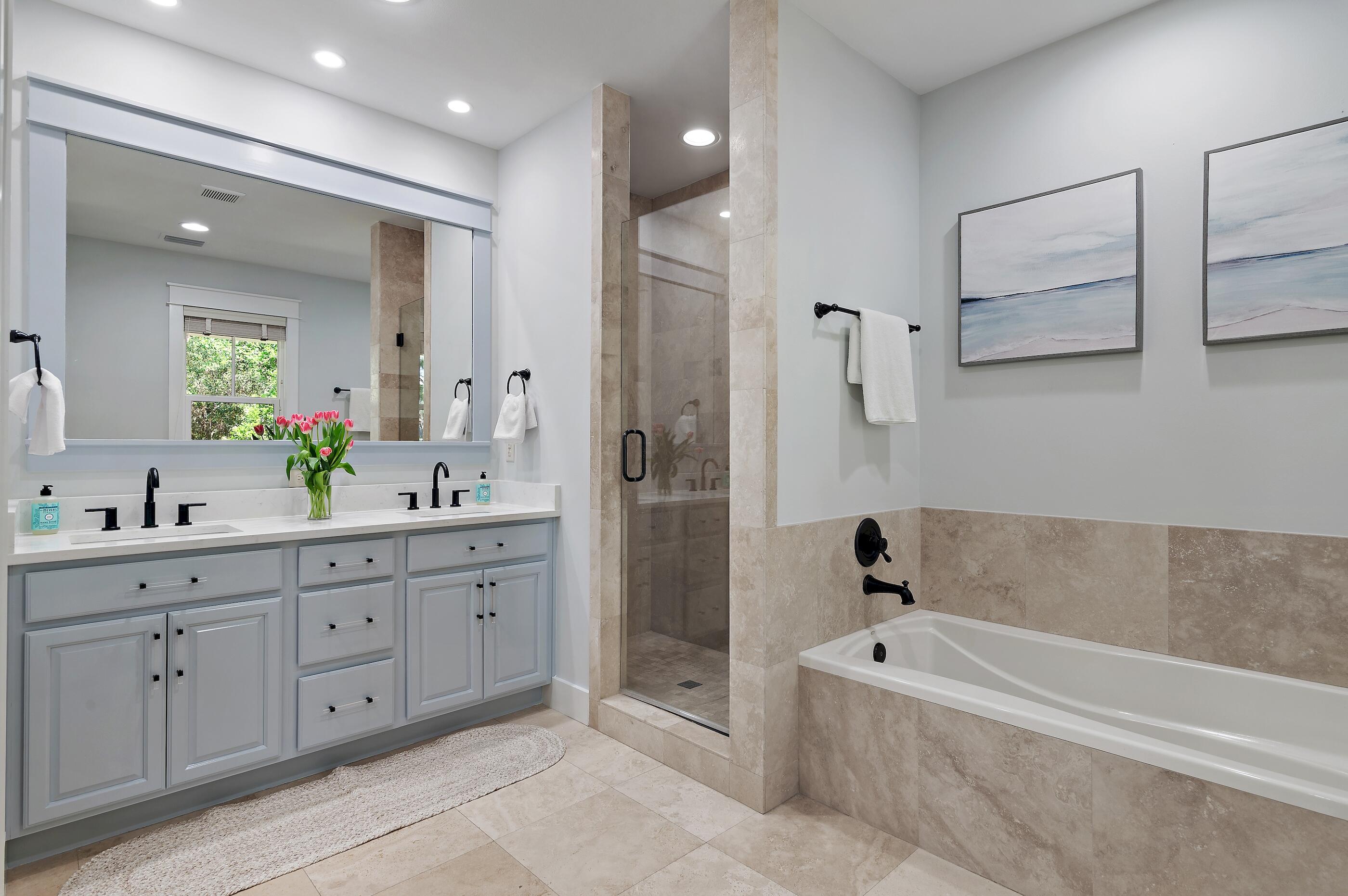 199 Anchor Rode Circle Santa Rosa Beach, FL 32459 - Photo 19 of 43 a spacious bathroom with a double vanity sink a mirror a bathtub and shower
