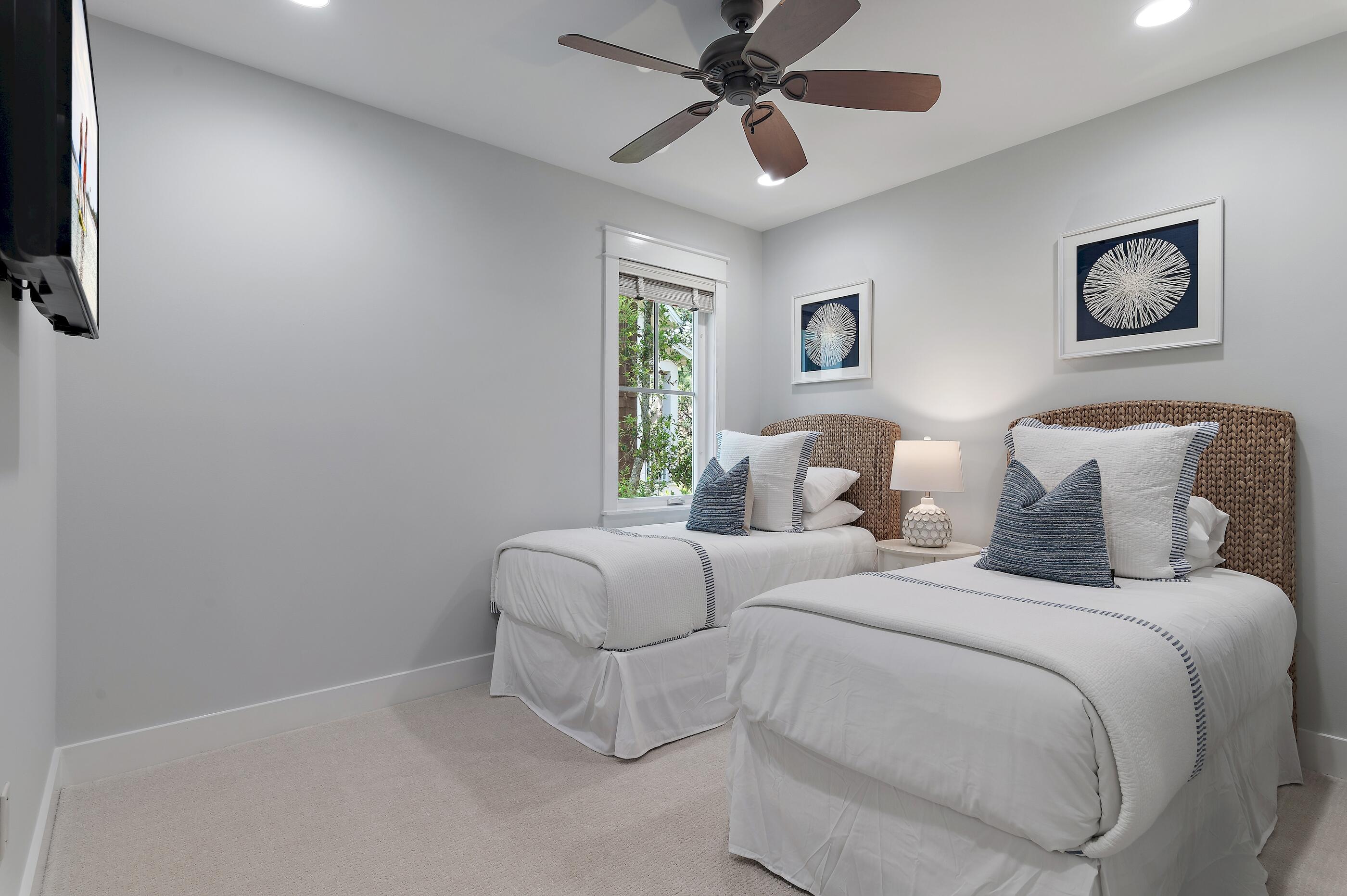 199 Anchor Rode Circle Santa Rosa Beach, FL 32459 - Photo 25 of 43 a bedroom with bed and a chandelier