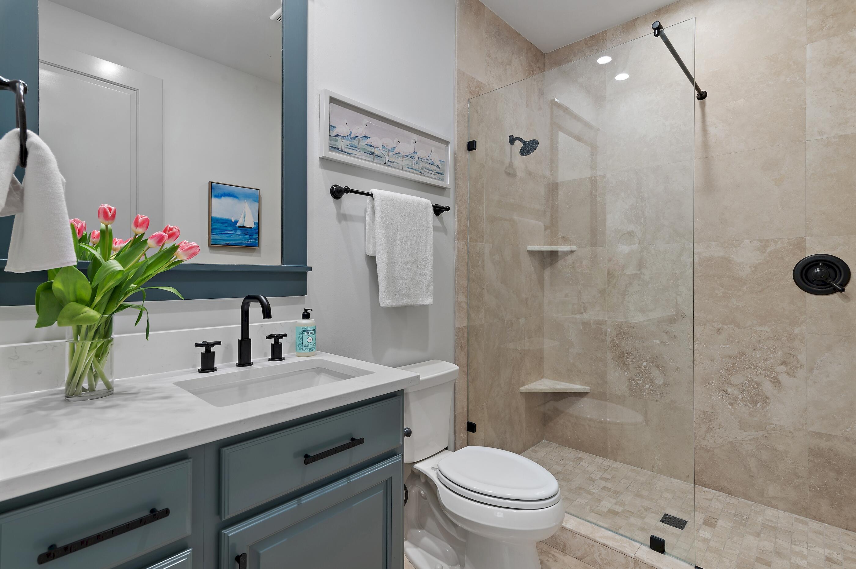 199 Anchor Rode Circle Santa Rosa Beach, FL 32459 - Photo 27 of 43 a bathroom with a sink a toilet a shower and a mirror