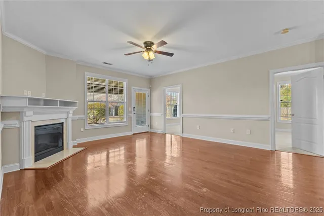 a kitchen with kitchen island granite countertop a refrigerator a stove a sink and dishwasher