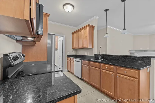 a kitchen with granite countertop a sink and cabinets