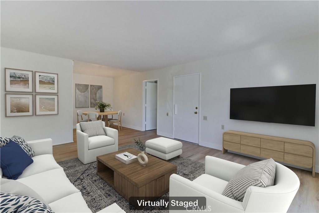 2123 Ronda Granada, Unit A Laguna Woods, CA 92637 - Photo 11 of 34 a living room with furniture and a flat screen tv