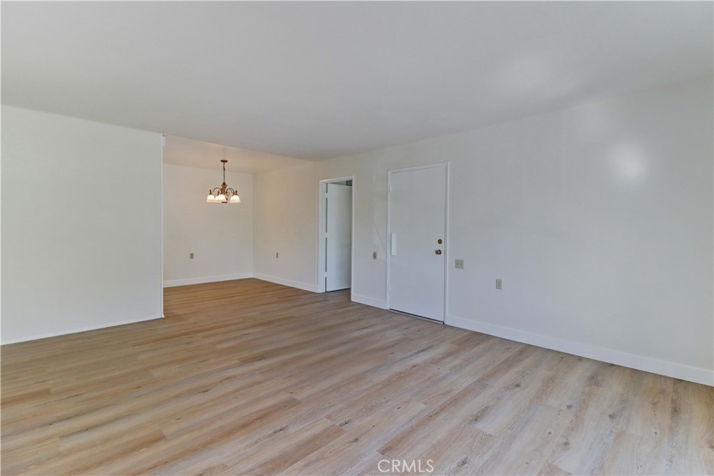2123 Ronda Granada, Unit A Laguna Woods, CA 92637 - Photo 12 of 34 a view of empty room with wooden floor