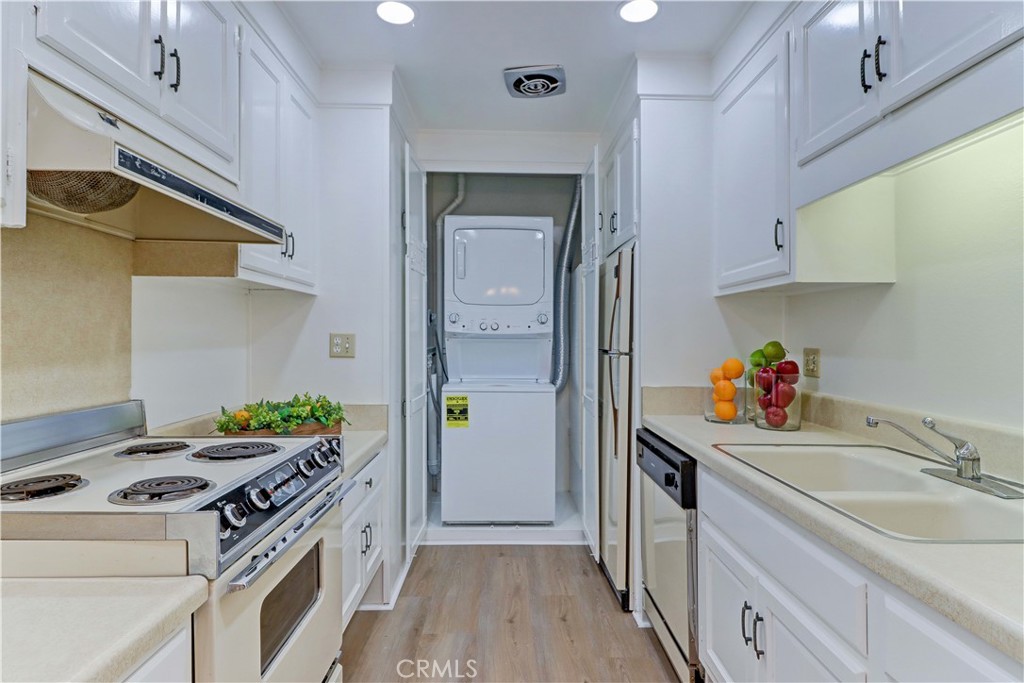 2123 Ronda Granada, Unit A Laguna Woods, CA 92637 - Photo 19 of 34 a kitchen with a stove and a sink