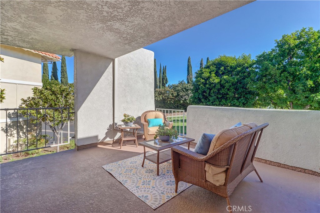 2123 Ronda Granada, Unit A Laguna Woods, CA 92637 - Photo 29 of 34 a view of a chairs and table in the patio