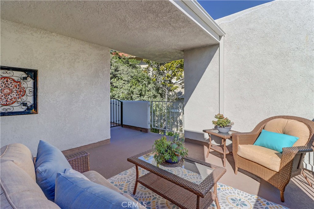 2123 Ronda Granada, Unit A Laguna Woods, CA 92637 - Photo 30 of 34 a living room with furniture and a potted plant