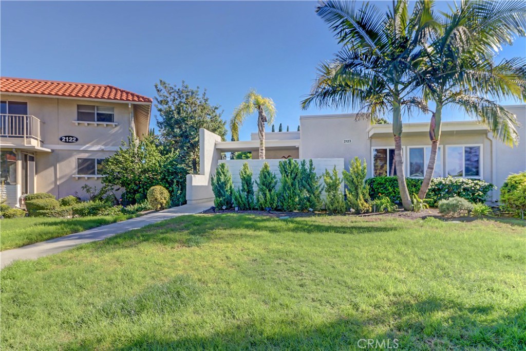 2123 Ronda Granada, Unit A Laguna Woods, CA 92637 - Photo 33 of 34 a front view of a house with garden