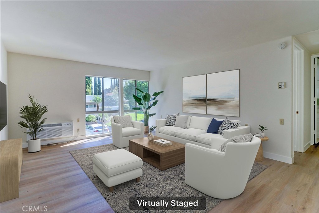 2123 Ronda Granada, Unit A Laguna Woods, CA 92637 - Photo 6 of 34 a living room with furniture and a large window