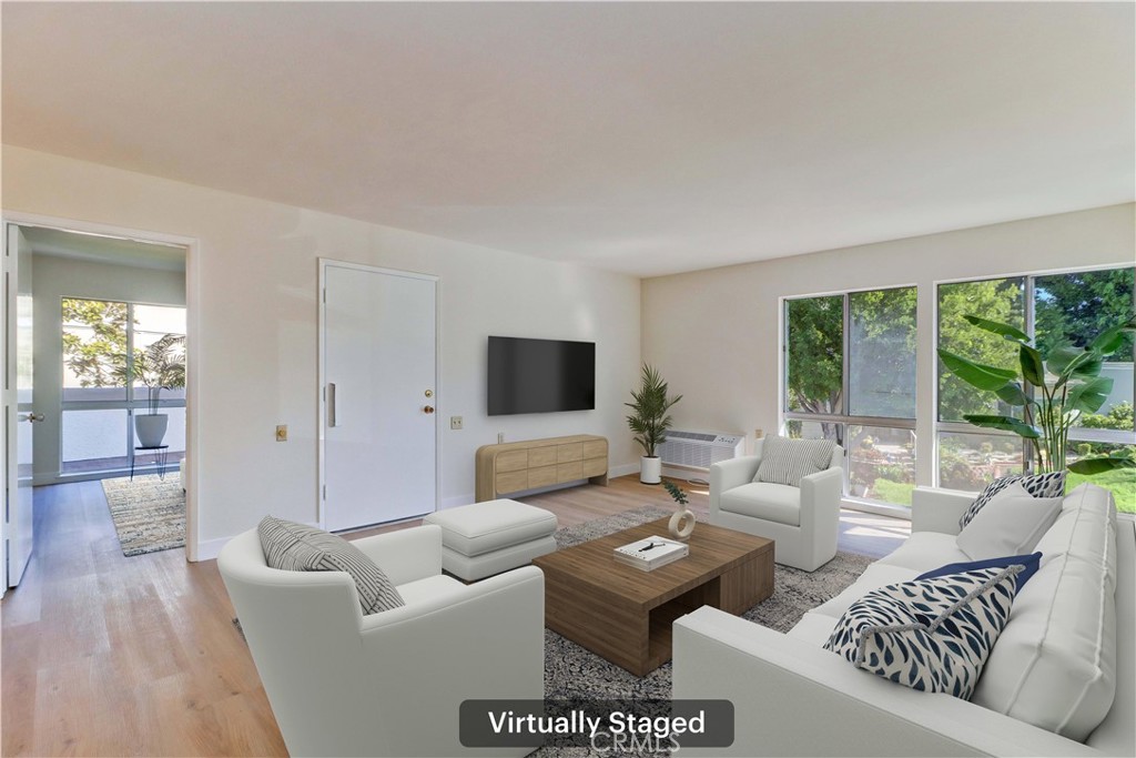 2123 Ronda Granada, Unit A Laguna Woods, CA 92637 - Photo 9 of 34 a living room with furniture and a flat screen tv