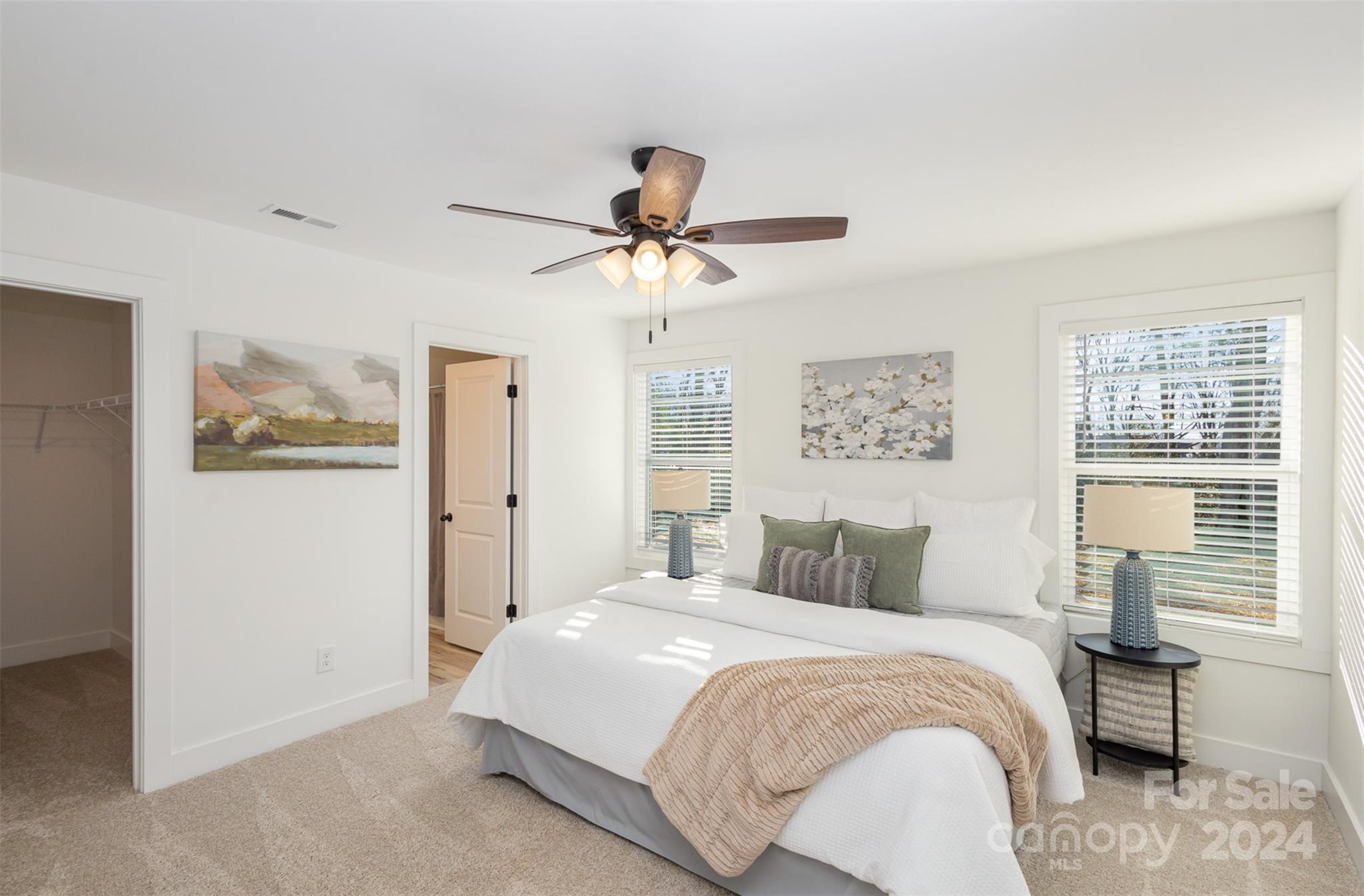 2832 South Ridge Avenue Concord, NC 28025 - Photo 12 of 18 a bedroom with a bed and a chandelier