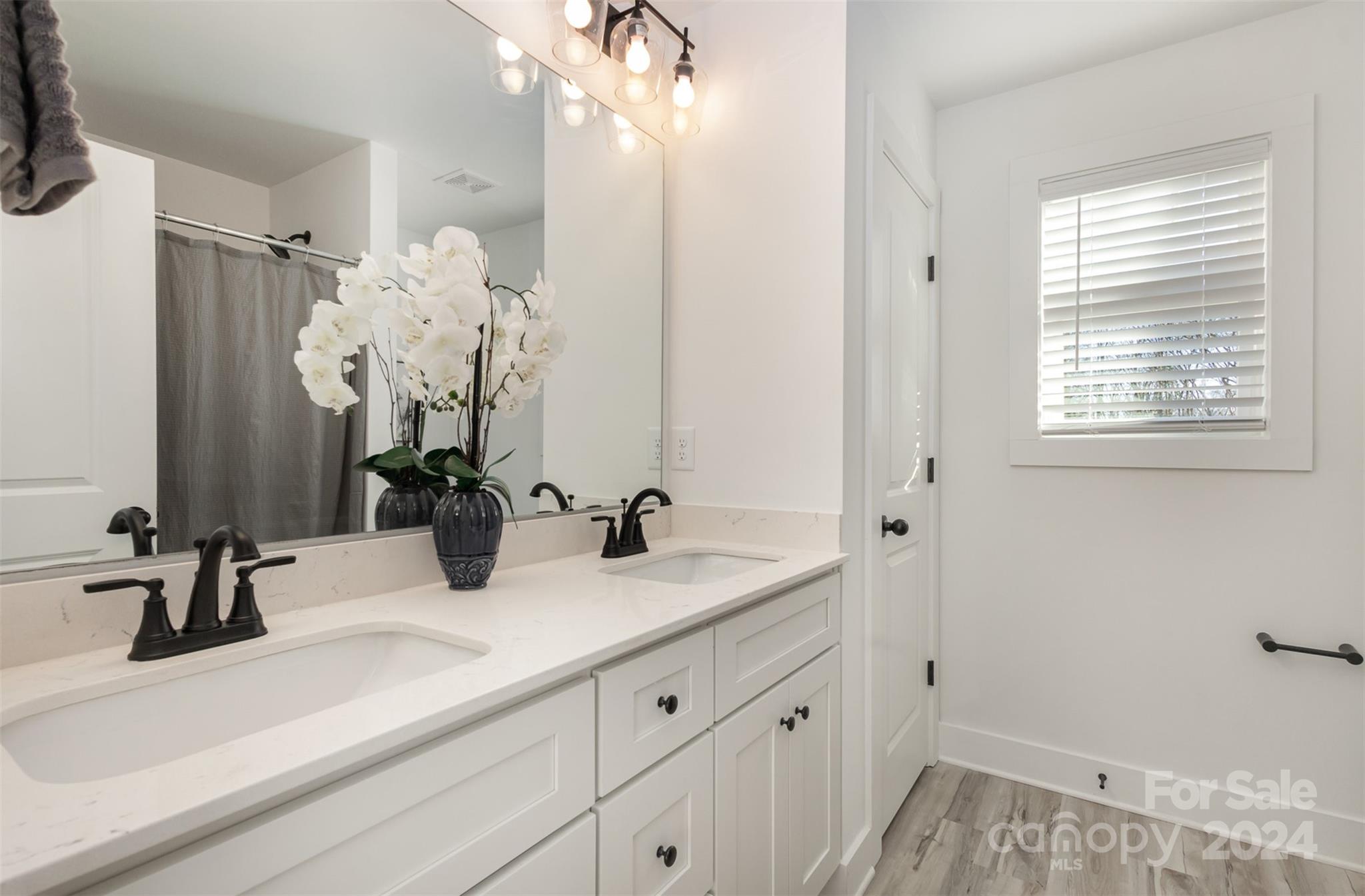 2832 South Ridge Avenue Concord, NC 28025 - Photo 14 of 18 a bathroom with a sink and a mirror