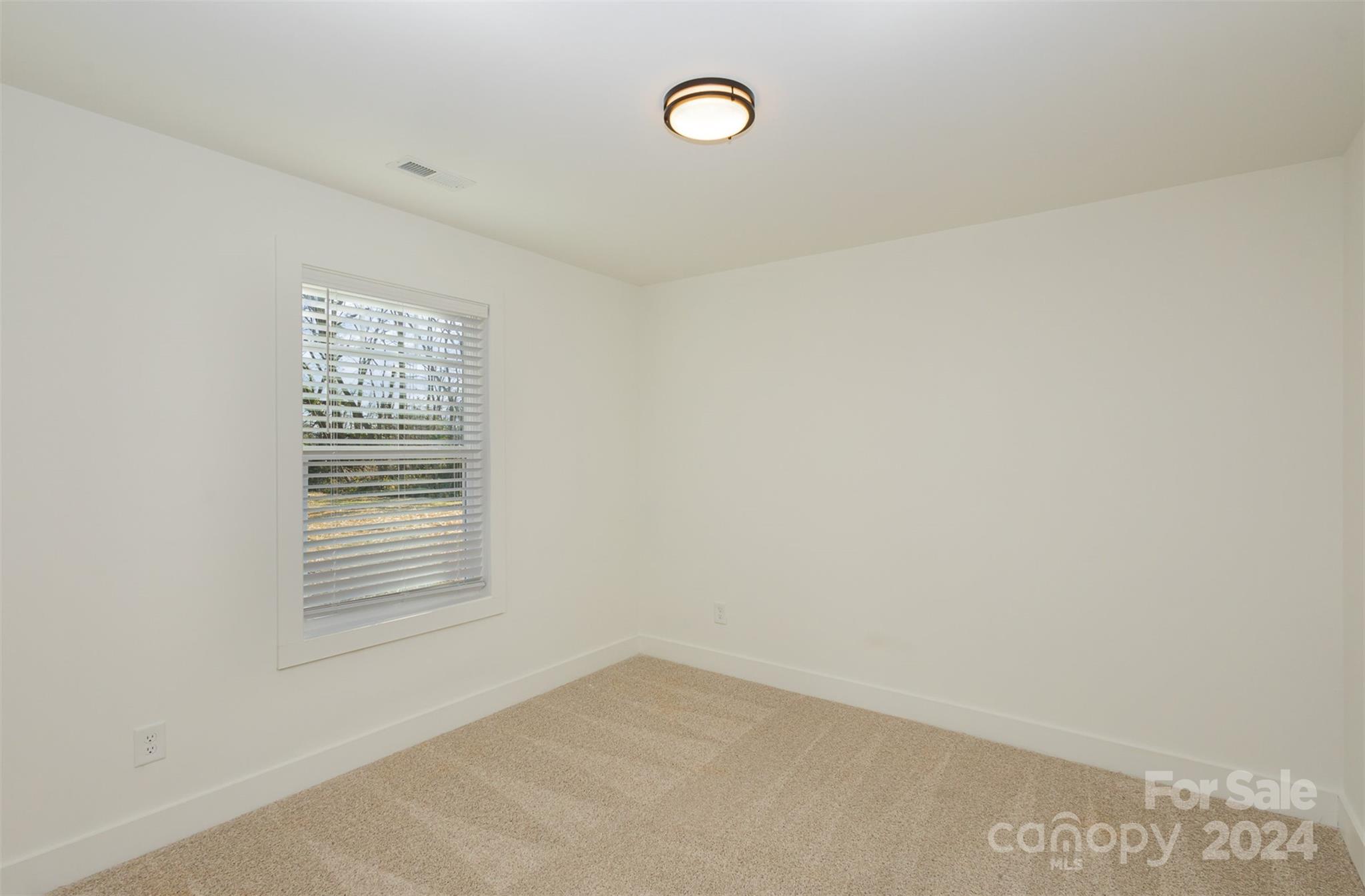 2832 South Ridge Avenue Concord, NC 28025 - Photo 15 of 18 a view of an empty room with a window