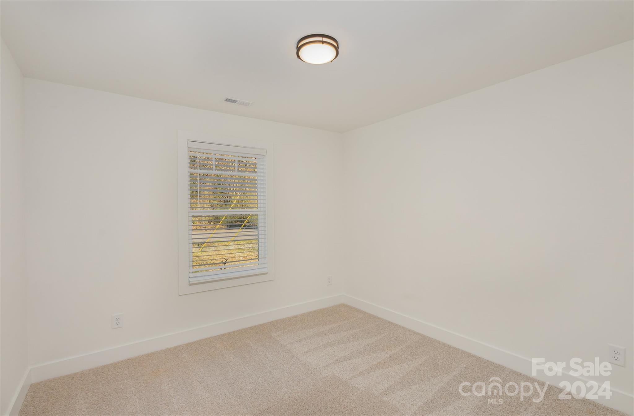 2832 South Ridge Avenue Concord, NC 28025 - Photo 16 of 18 a view of a room that has a window in it