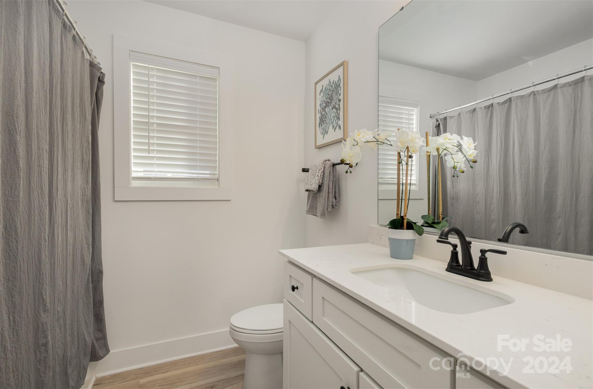 2832 South Ridge Avenue Concord, NC 28025 - Photo 17 of 18 a bathroom with a granite countertop sink toilet and shower
