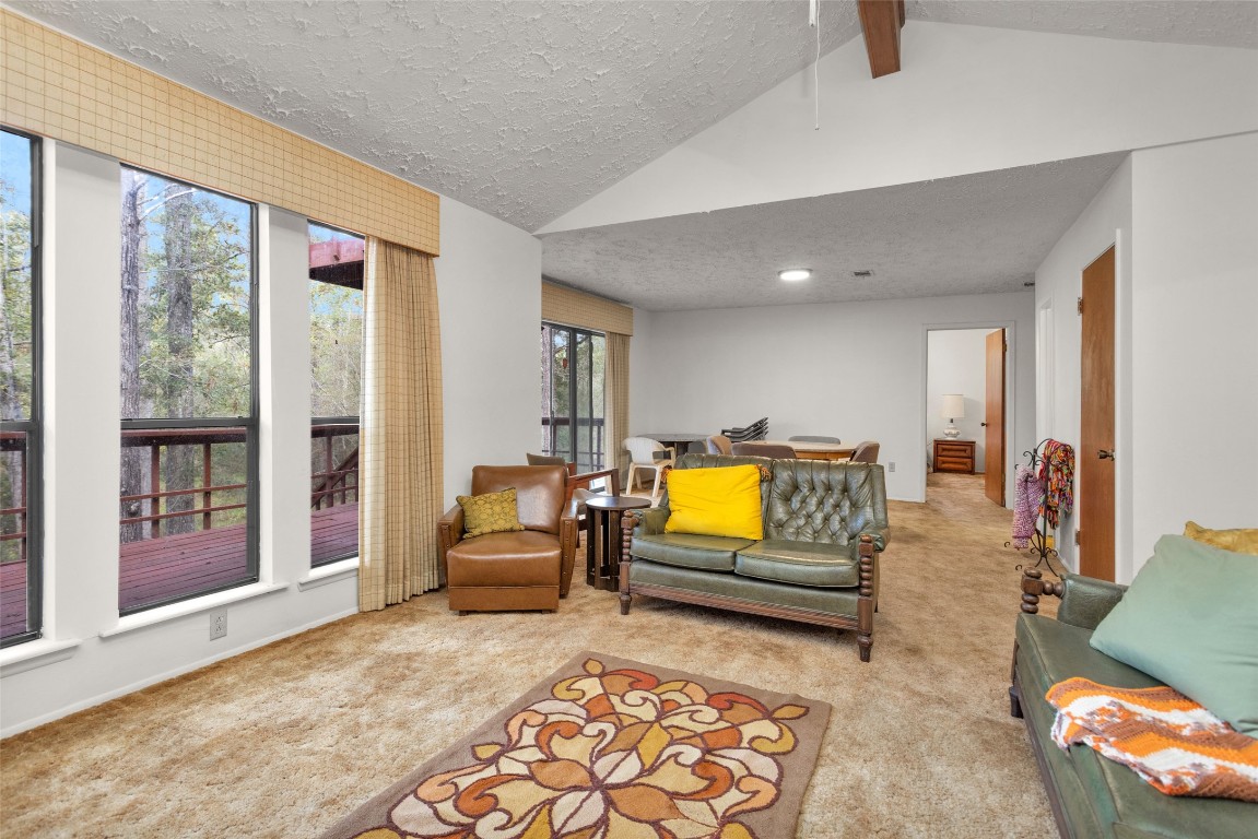7415 Honea Egypt Road Montgomery, TX 77316 - Photo 21 of 50 a bedroom with furniture and large windows