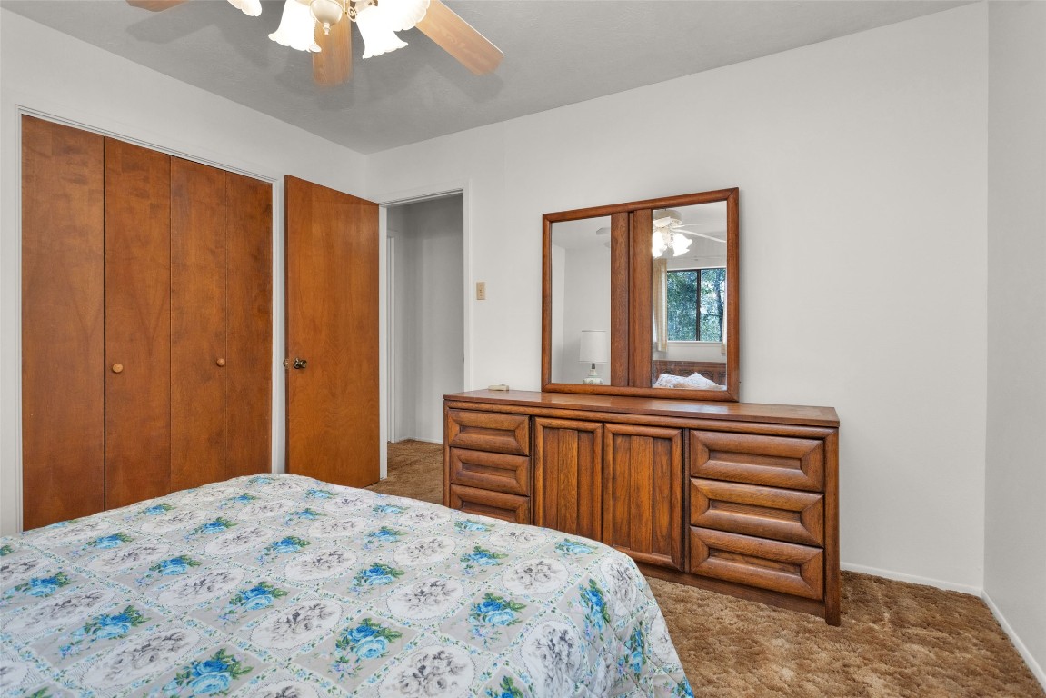 7415 Honea Egypt Road Montgomery, TX 77316 - Photo 32 of 50 a bedroom with a bed and a dresser