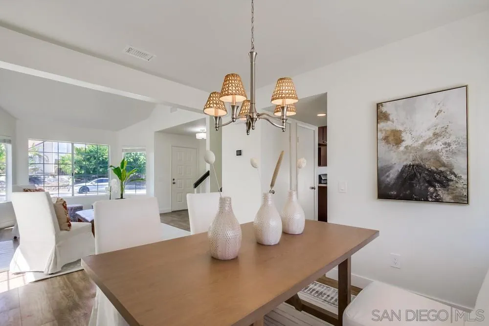 1376 Darwin Drive Oceanside, CA 92056 - Photo 19 of 63 a view of a dining room with furniture window and wooden floor