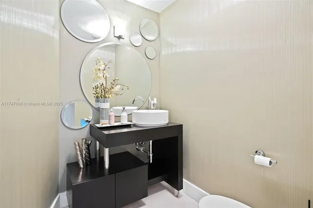 a spacious bedroom with a bed a couch and dresser