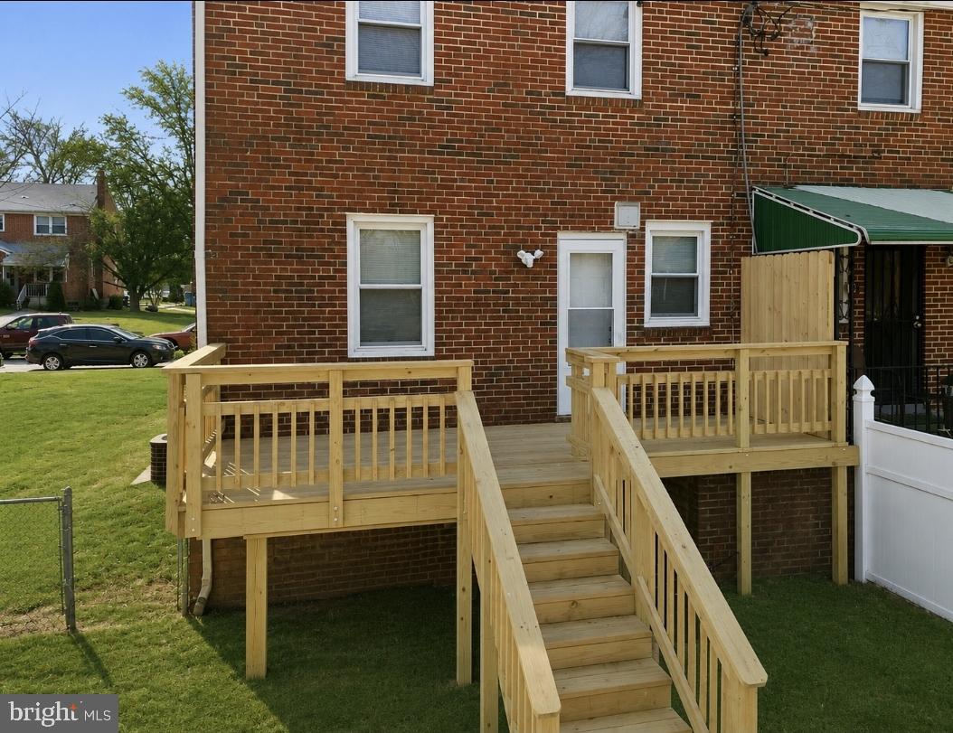 5102 Plymouth Road Baltimore, MD 21214 - Photo 26 of 32 a front view of a house with a yard