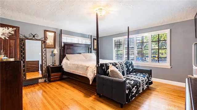 a bed room with a bed and a window